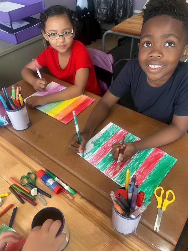 Two children colouring and doing crafts at Toddies Preschool