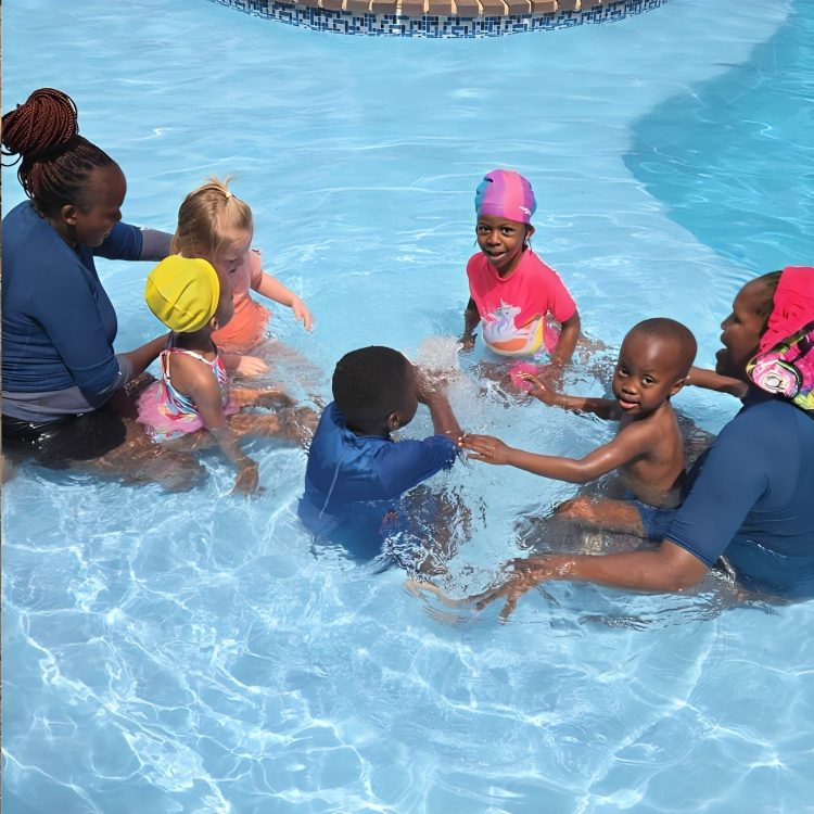 Toddies children enjoying a group swimming lesson in the pool